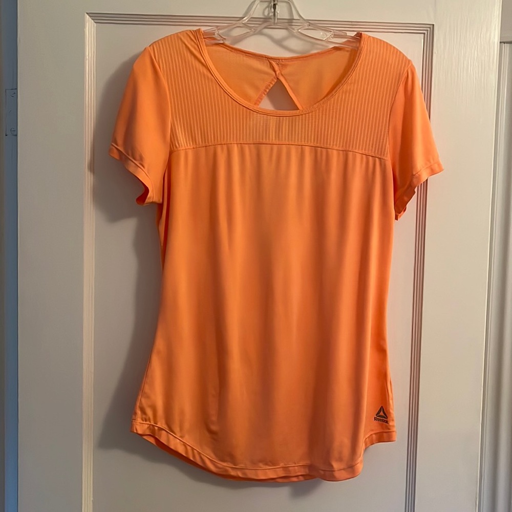 Reebok athletic workout top Women’s size M orange for visibility when running